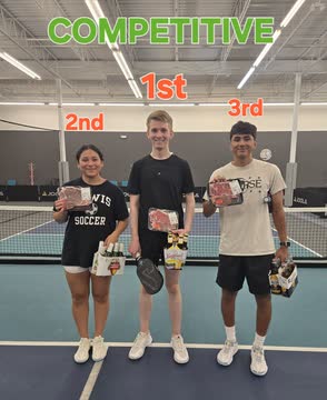 Leonid on the podium in first place at a pickleball tournament